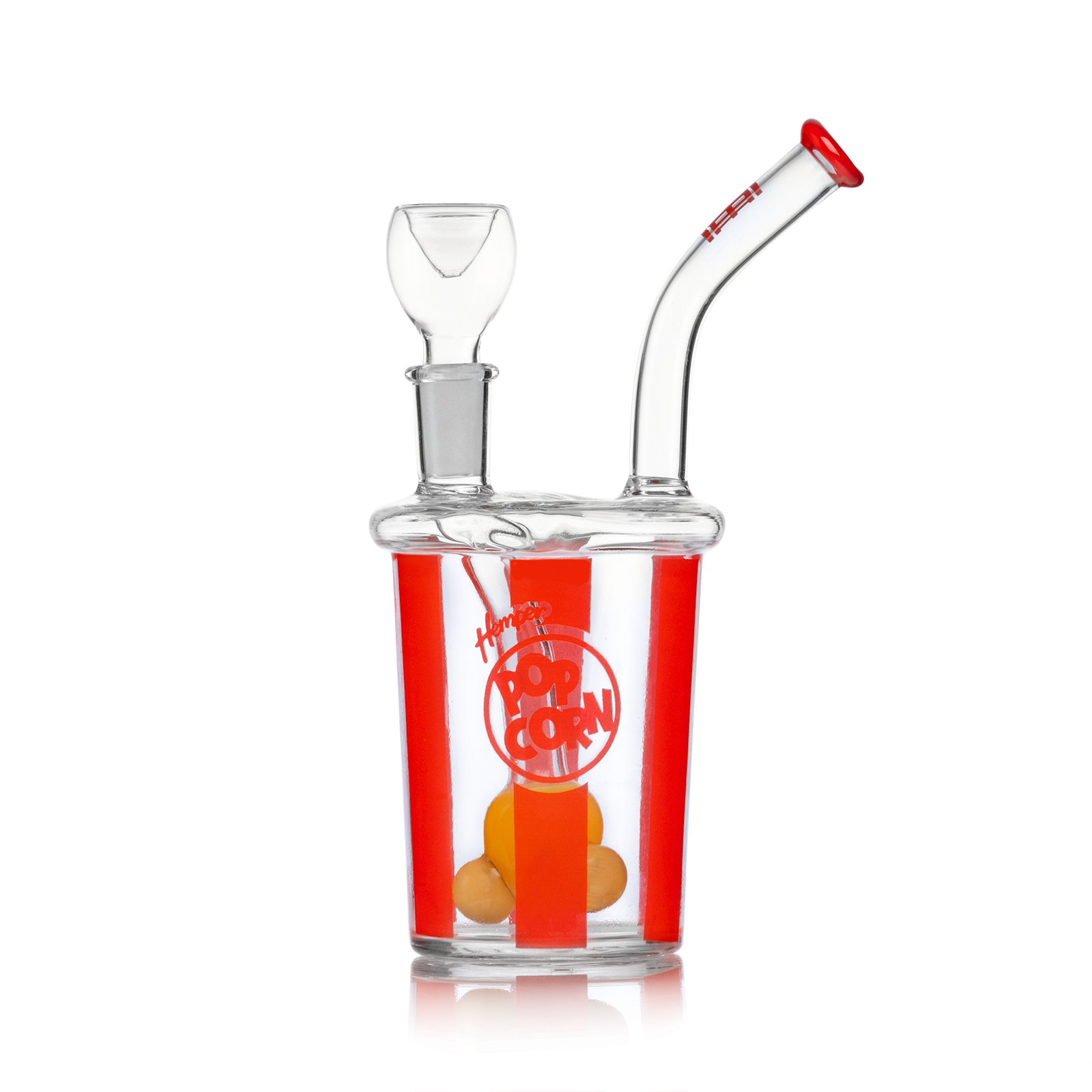 A front view of the Popcorn Bong, showcasing its clear glass construction and a rounded base reflecting on a glossy surface. A front view of the Popcorn Bong, showcasing its clear glass construction and a rounded base reflecting on a glossy surface.