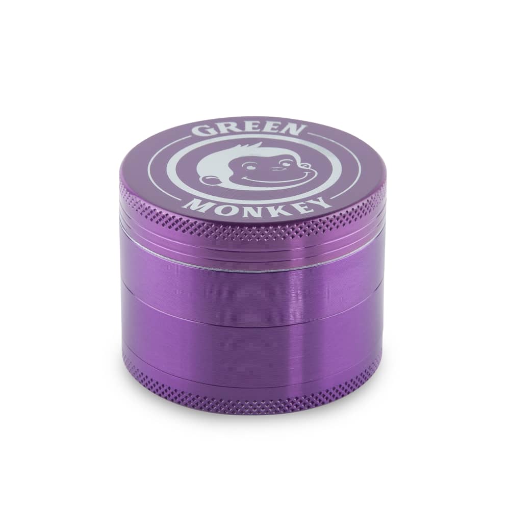 Front view of the Capuchin 55mm Grinder, a purple metal grinder photographed in a studio setting with soft, even lighting. Front view of the Capuchin 55mm Grinder, a purple metal grinder photographed in a studio setting with soft, even lighting.