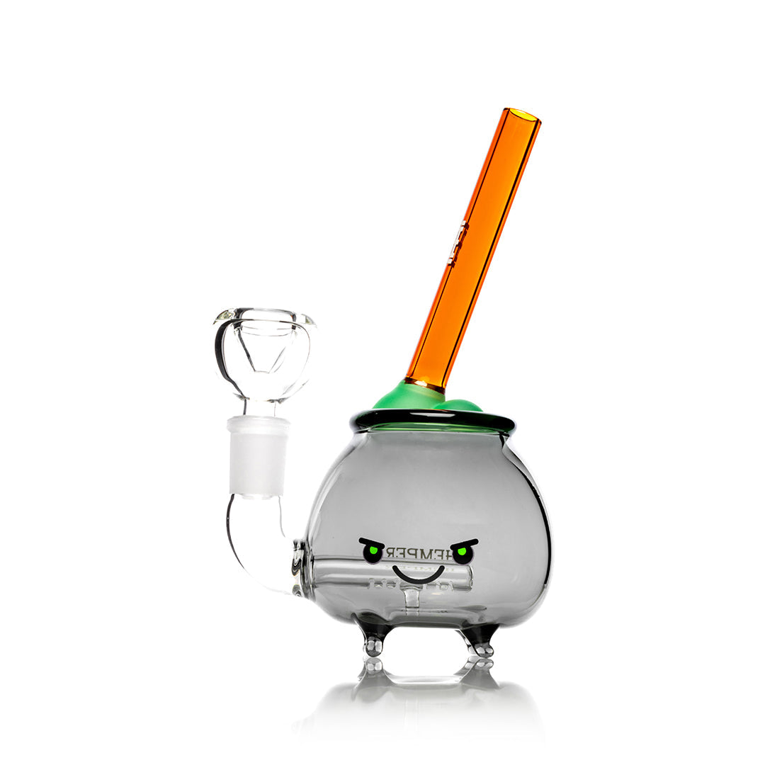 Front view of the Cauldron Bong, a clear glass piece with a rounded base and a vibrant orange mouthpiece. Front view of the Cauldron Bong, a clear glass piece with a rounded base and a vibrant orange mouthpiece.