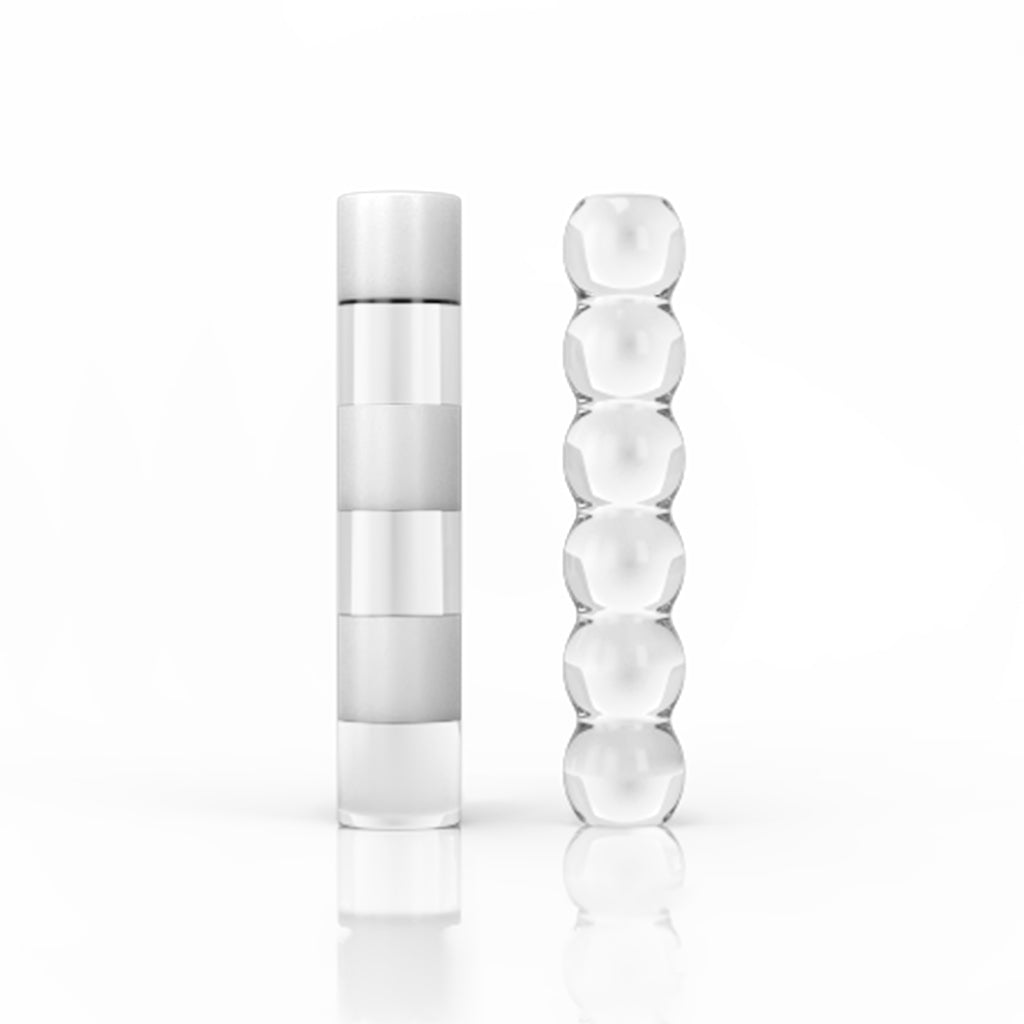 A studio shot of stacked Zebra & Bubble Pillars, showcasing their clear, cylindrical forms against a bright white background. A studio shot of stacked Zebra & Bubble Pillars, showcasing their clear, cylindrical forms against a bright white background.
