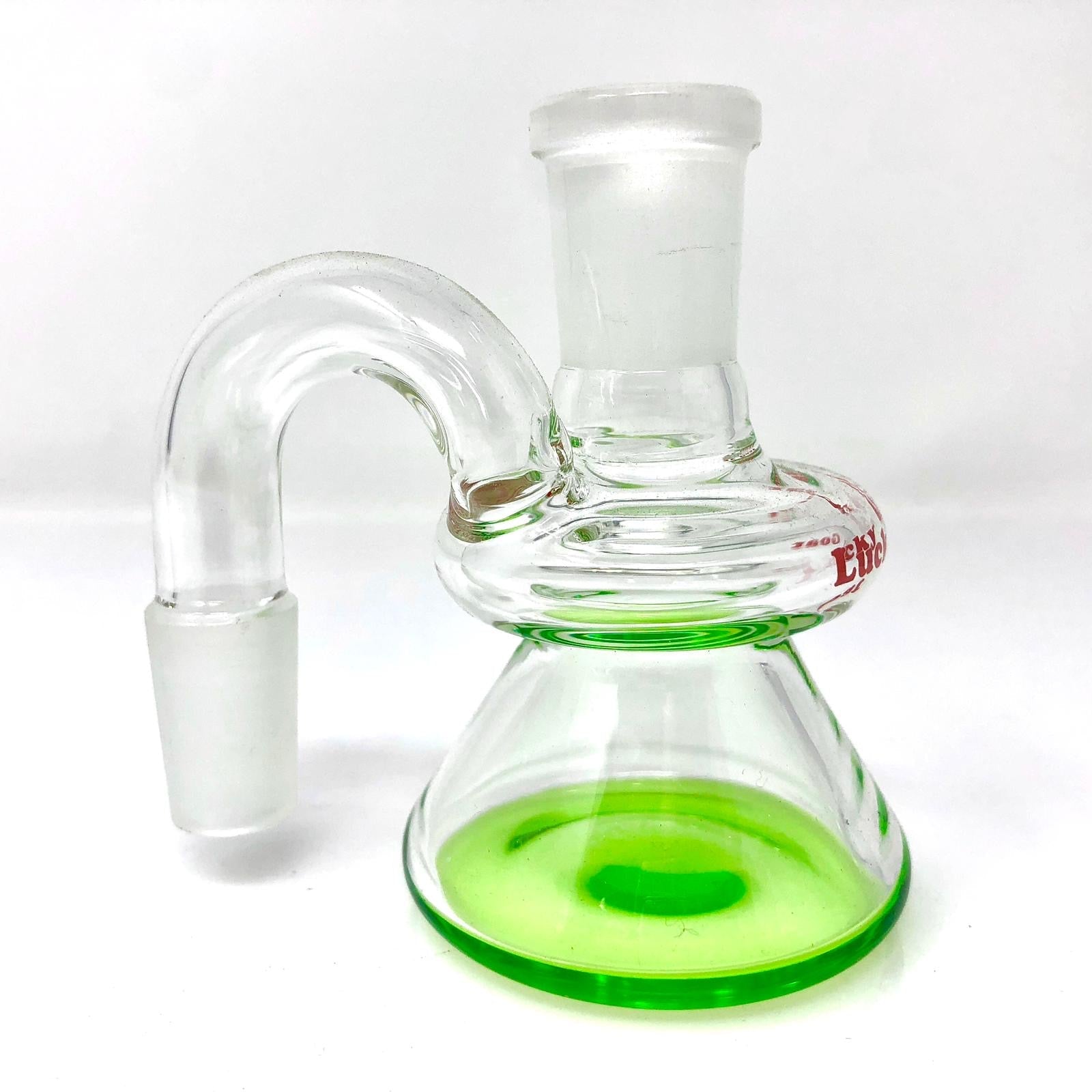A three-quarter view of the Lucky Goat Color Glass Dry Ashcatcher, displaying a colorful, curved glass piece against a plain white background. A three-quarter view of the Lucky Goat Color Glass Dry Ashcatcher, displaying a colorful, curved glass piece against a plain white background.