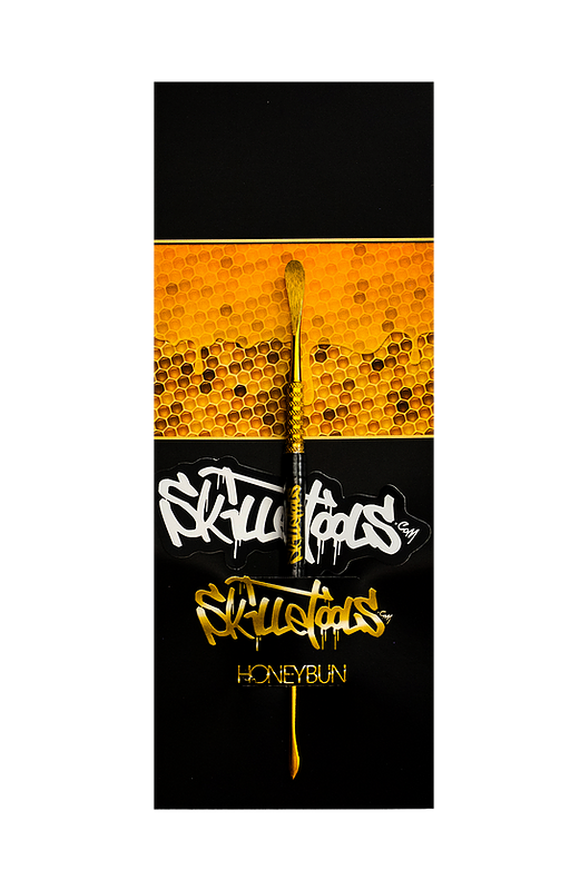 Front view of the Gold Honeybun Dabber with a golden, textured background and clean lines. Front view of the Gold Honeybun Dabber with a golden, textured background and clean lines.