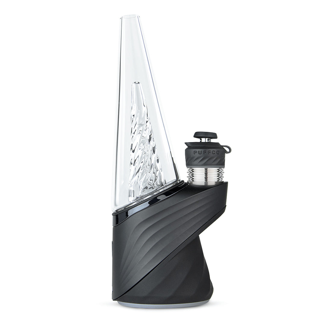 A three-quarter view of the Puffco New Peak Pro with 3DXL Chamber Onyx, displaying its sleek black design and glass chamber. A three-quarter view of the Puffco New Peak Pro with 3DXL Chamber Onyx, displaying its sleek black design and glass chamber.