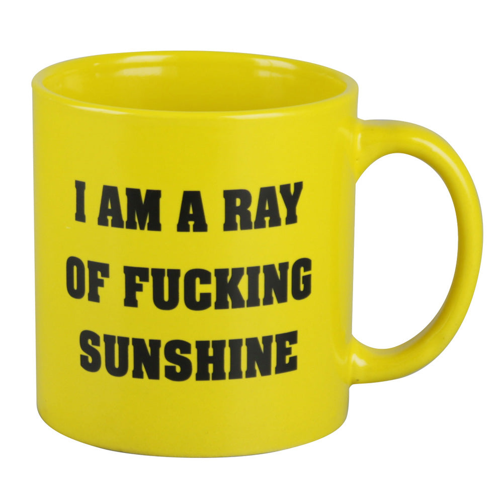A close-up, angled view of the “I am a Ray of Fucking Sunshine Mug” with bold, white text on a vibrant yellow background. A close-up, angled view of the “I am a Ray of Fucking Sunshine Mug” with bold, white text on a vibrant yellow background.