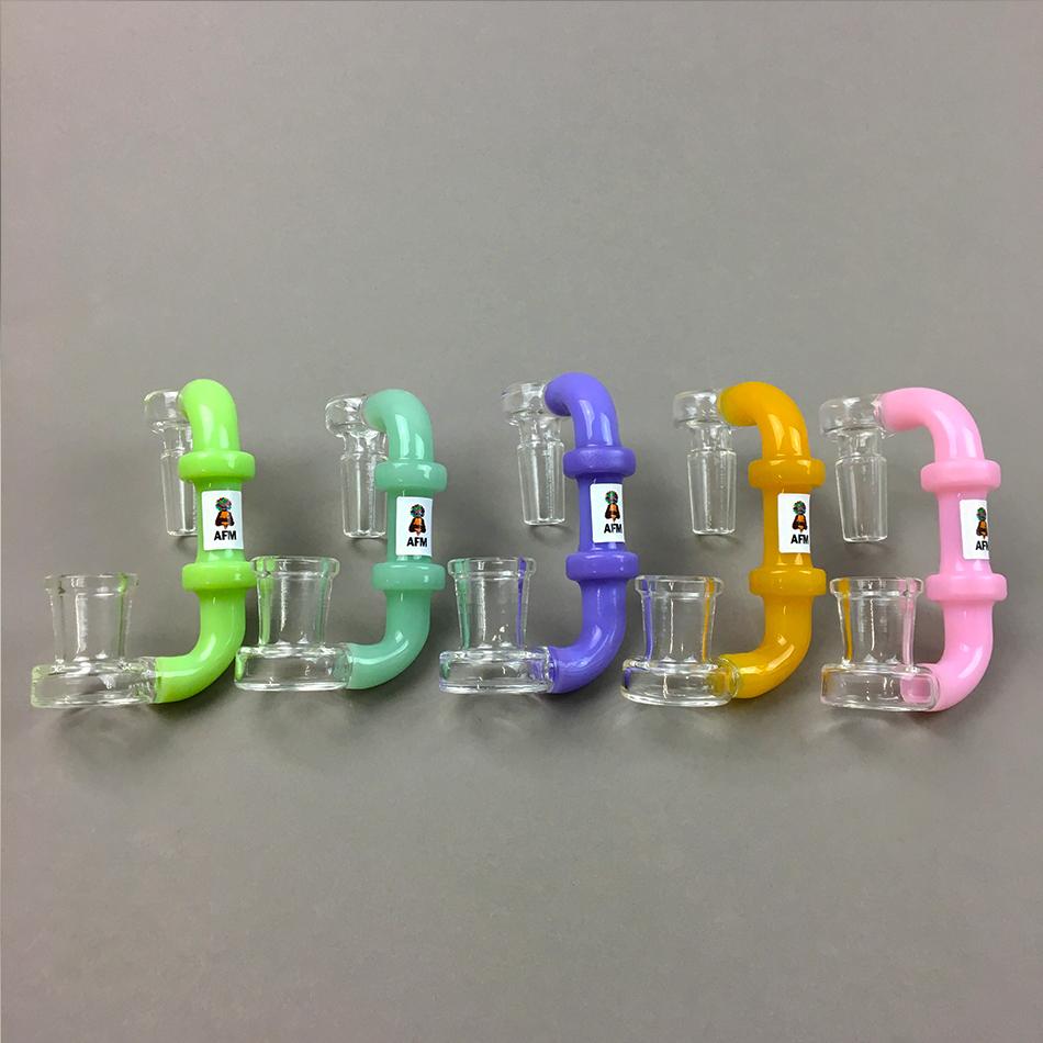 A studio shot displays the Colored Down Drop, with multiple glass pieces arranged against a neutral gray background. A studio shot displays the Colored Down Drop, with multiple glass pieces arranged against a neutral gray background.