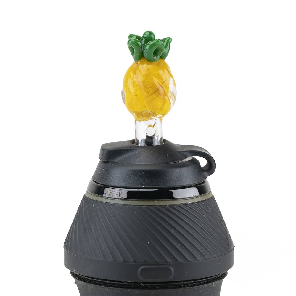 A close-up, top-down view of the Pineapple PuffCo Proxy Glass Ball Cap, showing a yellow, pineapple-shaped glass cap. A close-up, top-down view of the Pineapple PuffCo Proxy Glass Ball Cap, showing a yellow, pineapple-shaped glass cap.