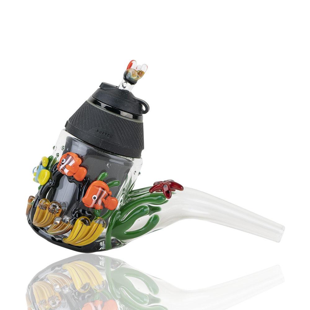A detailed side view of the Under the Sea PuffCo Proxy Glass Attachment Set, showcasing colorful aquatic-themed glasswork. A detailed side view of the Under the Sea PuffCo Proxy Glass Attachment Set, showcasing colorful aquatic-themed glasswork.