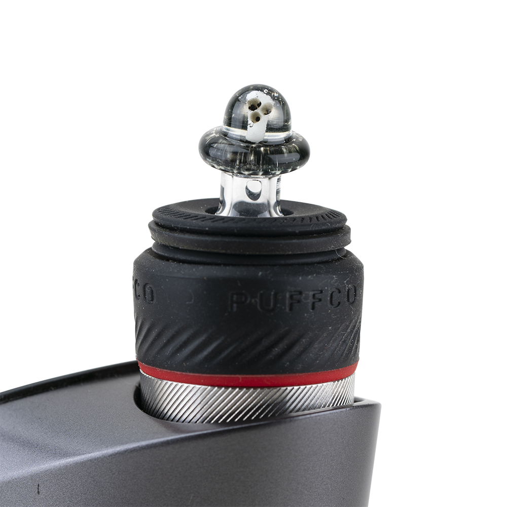 Close-up of the Martian PuffCo Peak Pro Glass Ball Cap, featuring a clear glass sphere with a textured surface and angled view. Close-up of the Martian PuffCo Peak Pro Glass Ball Cap, featuring a clear glass sphere with a textured surface and angled view.