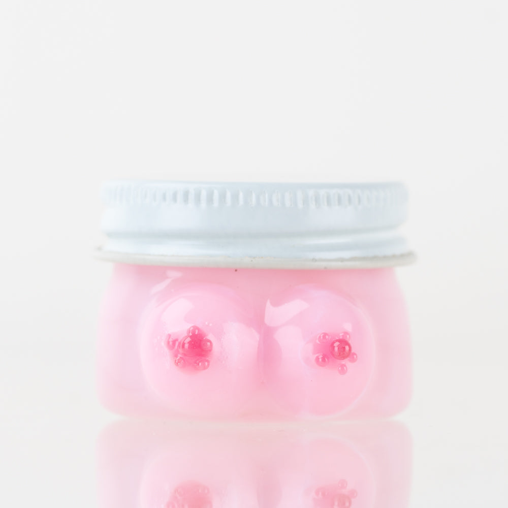 Close-up, top-down view of the Boobies Terp Jar, showcasing its playful, rounded shape and translucent material. Close-up, top-down view of the Boobies Terp Jar, showcasing its playful, rounded shape and translucent material.