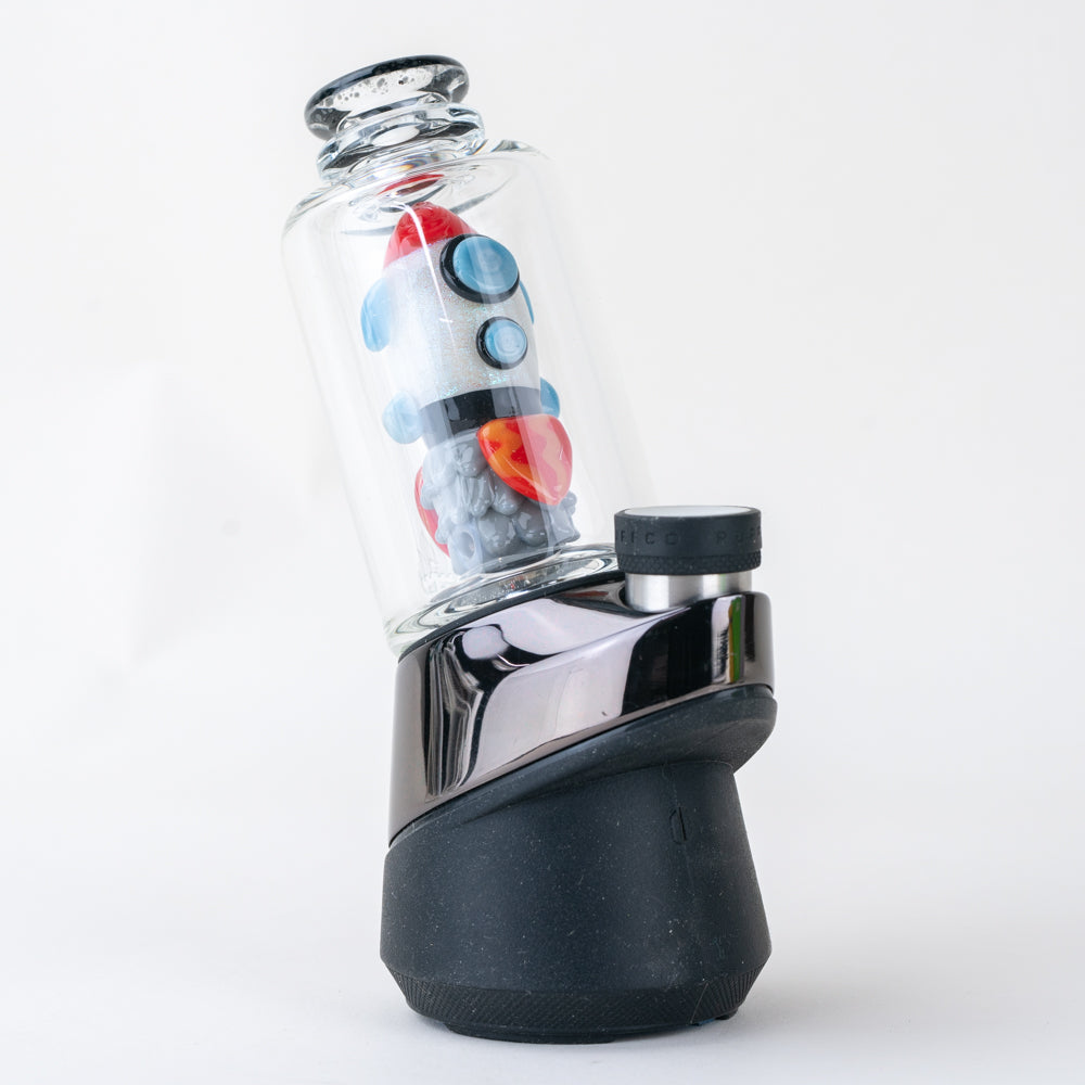 A vibrant, close-up view of the PuffCo Peak & Peak Pro Glass Attachment, showcasing its colorful, swirled glass design. A vibrant, close-up view of the PuffCo Peak & Peak Pro Glass Attachment, showcasing its colorful, swirled glass design.