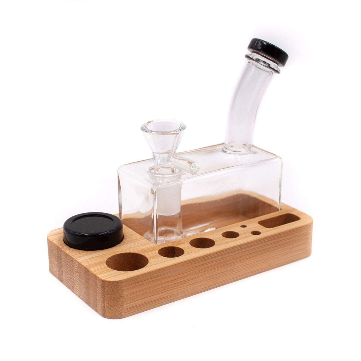 The Dab Slab Mini Rig Tray is shown in a high-angle view, displaying a clear glass rig resting on a wooden tray. The Dab Slab Mini Rig Tray is shown in a high-angle view, displaying a clear glass rig resting on a wooden tray.
