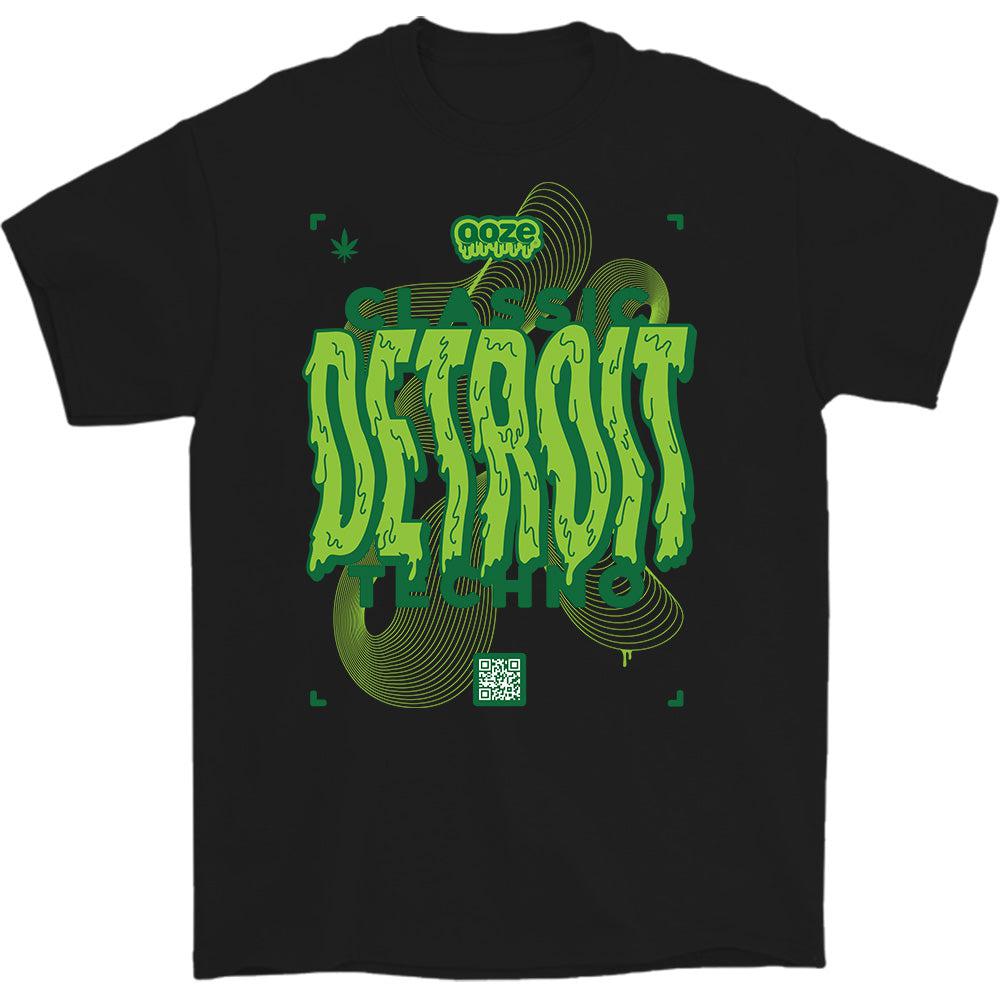 Front view of the Detroit Techno T-Shirt with a graphic design resembling sound waves on a black background. Front view of the Detroit Techno T-Shirt with a graphic design resembling sound waves on a black background.