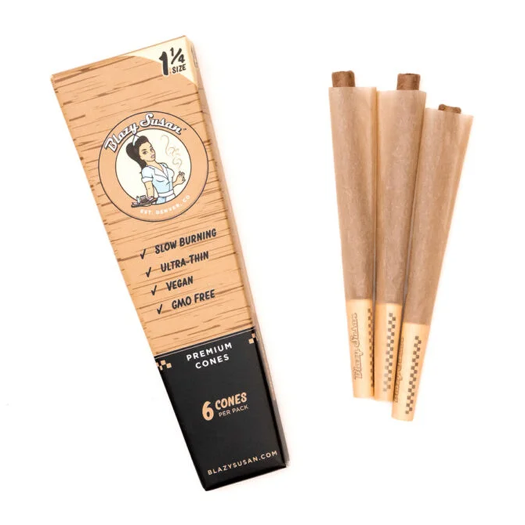Unbleached Premium Cones are displayed in a close-up, angled shot showing their rolled paper texture and branded packaging. Unbleached Premium Cones are displayed in a close-up, angled shot showing their rolled paper texture and branded packaging.