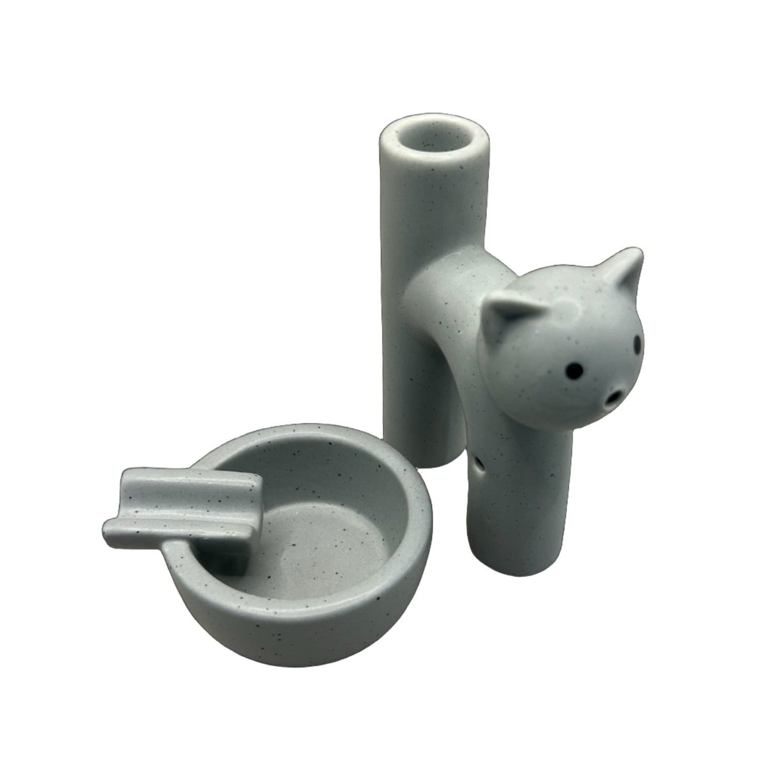 The Kitty Cat Pipe & Ashtray is displayed in a top-down view, showcasing its curved shape and smooth, pale green finish. The Kitty Cat Pipe & Ashtray is displayed in a top-down view, showcasing its curved shape and smooth, pale green finish.