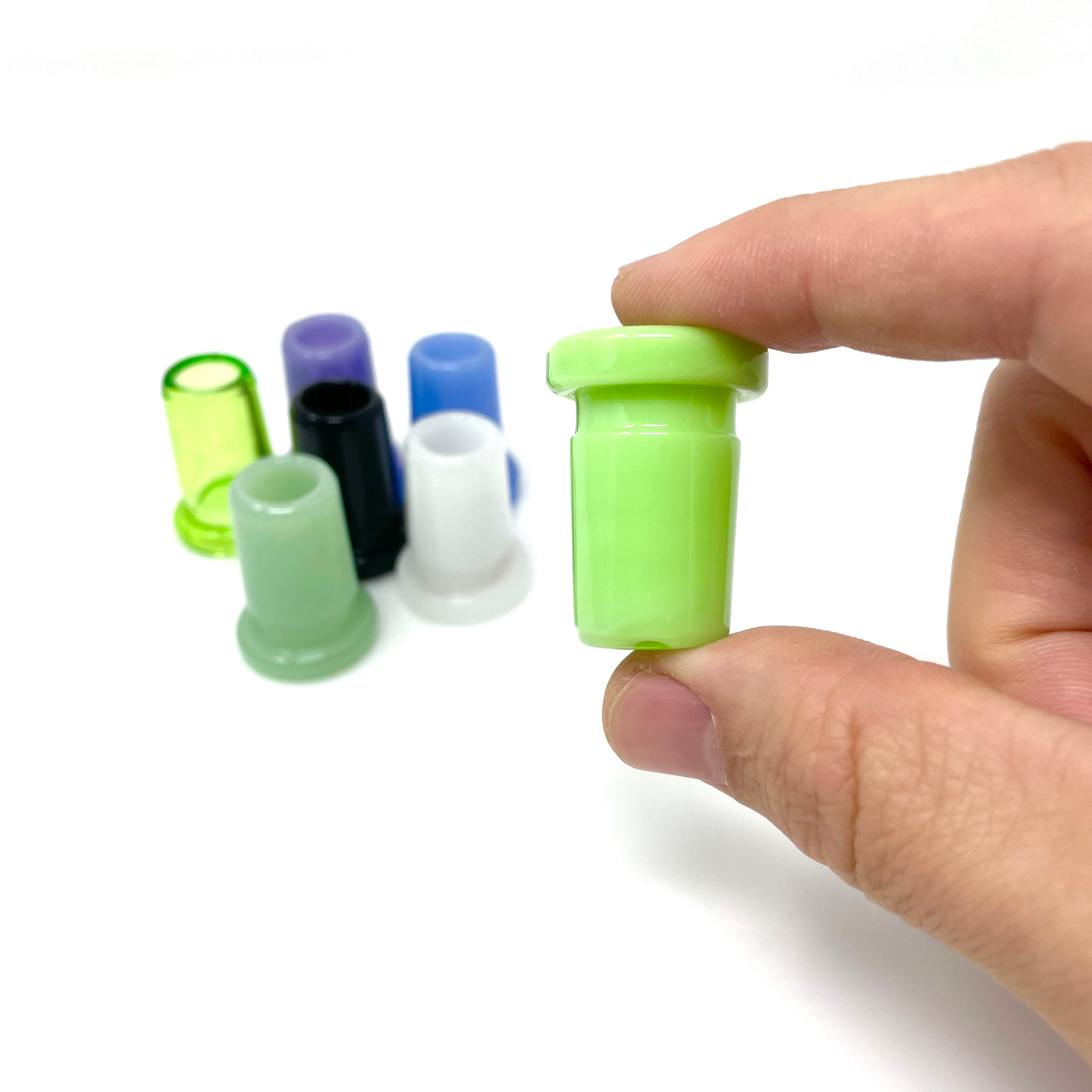 A hand holds several colorful AFM Colored Joint Reducers, displayed at a slight angle against a plain white background. A hand holds several colorful AFM Colored Joint Reducers, displayed at a slight angle against a plain white background.