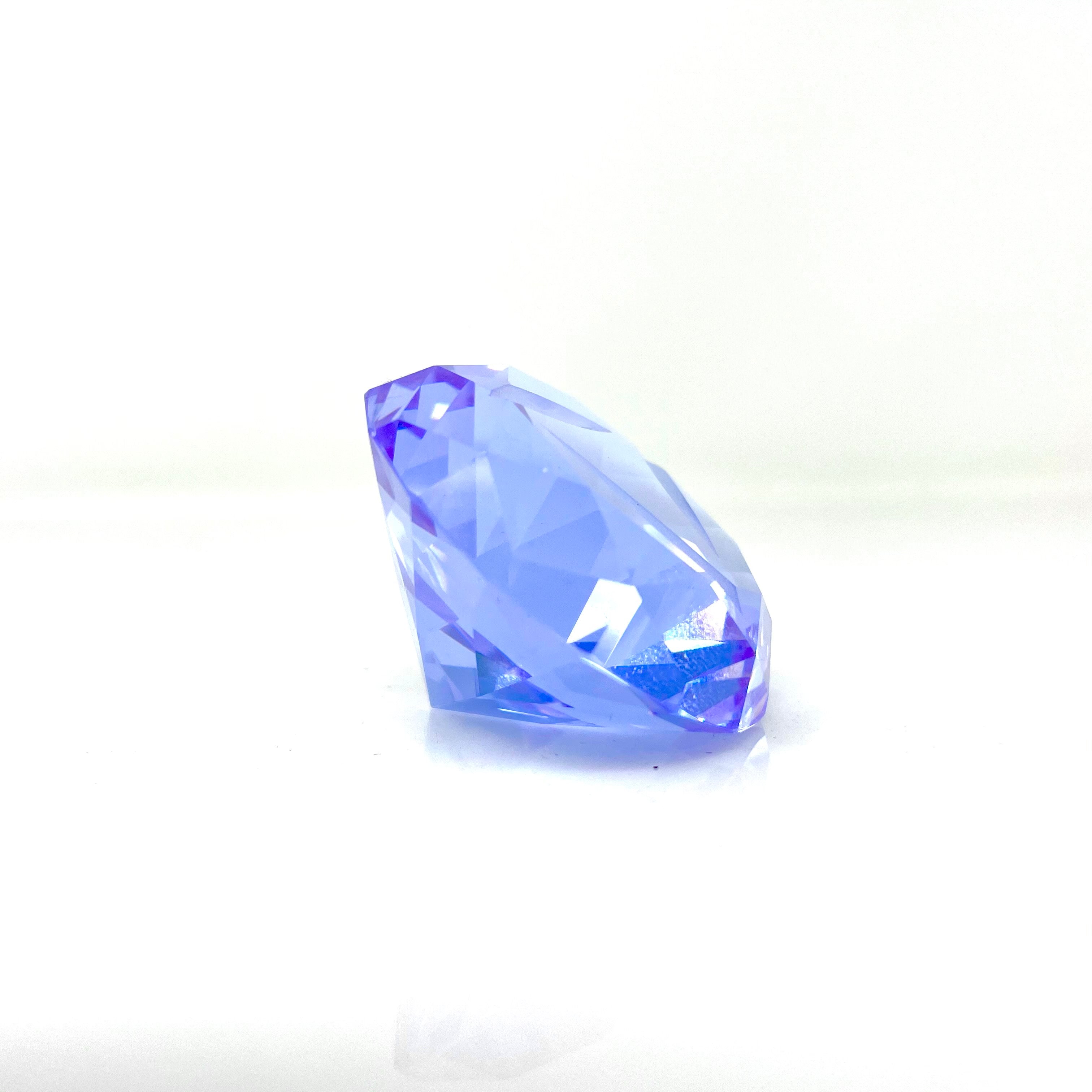 A slightly angled, top-down view of the Diamond Spinner Cap, showing its smooth, reflective surface against a plain white background. A slightly angled, top-down view of the Diamond Spinner Cap, showing its smooth, reflective surface against a plain white background.