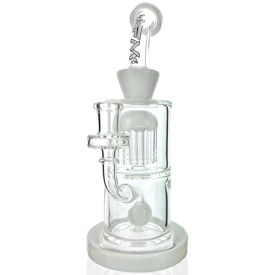 A studio shot of the Astor Double Perc Rig, showcasing its clear glass construction and multi-chamber percolator design from a low angle. A studio shot of the Astor Double Perc Rig, showcasing its clear glass construction and multi-chamber percolator design from a low angle.
