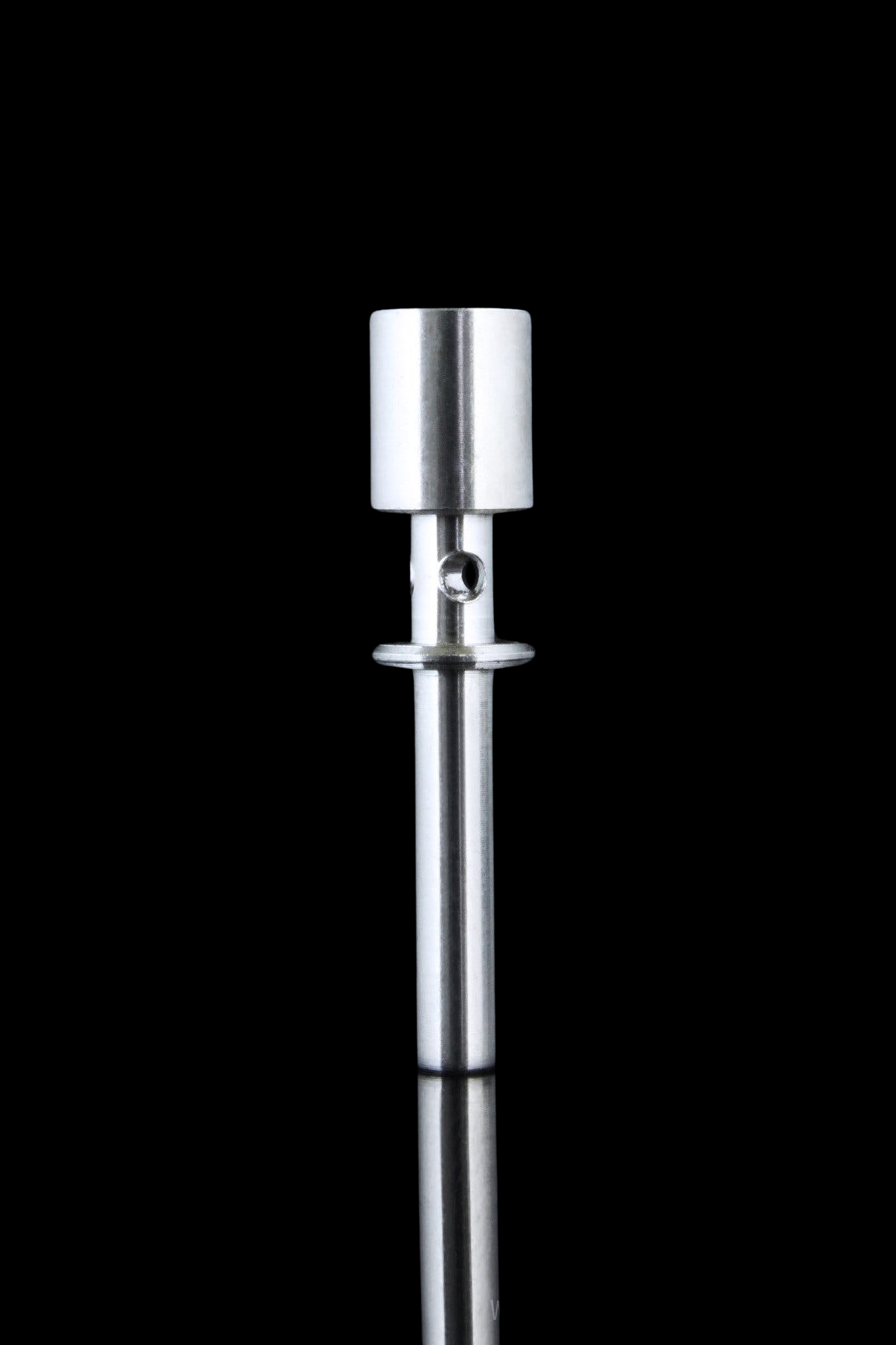 A studio shot of the Flux Titanium Nail, presented in a sleek, vertical composition against a dark, reflective surface. A studio shot of the Flux Titanium Nail, presented in a sleek, vertical composition against a dark, reflective surface.