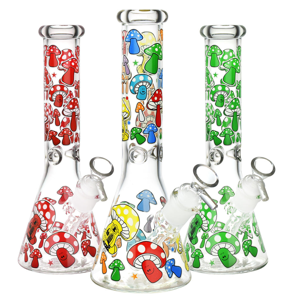 Front view of the Glow Mushroom Beaker Water Pipe, a clear glass beaker decorated with colorful mushroom graphics. Front view of the Glow Mushroom Beaker Water Pipe, a clear glass beaker decorated with colorful mushroom graphics.
