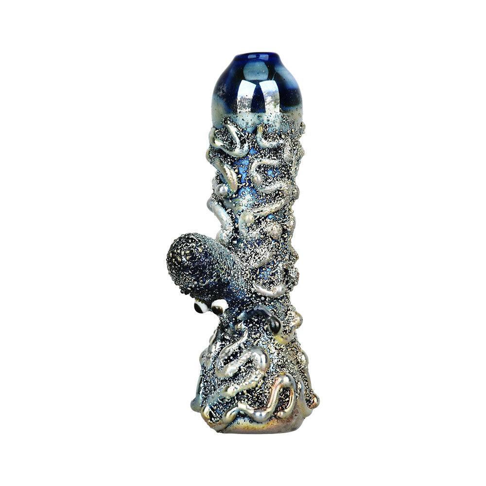 A detailed studio shot of the Curious Kraken Metallic Electroplated Glass Chillum, showcasing its textured, metallic finish and compact size. A detailed studio shot of the Curious Kraken Metallic Electroplated Glass Chillum, showcasing its textured, metallic finish and compact size.