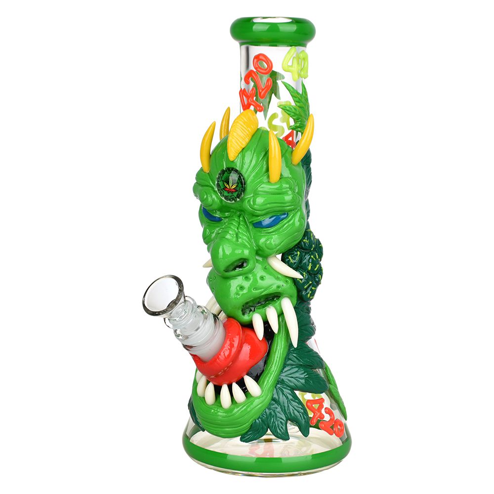 Front view of the 420 Dragon Glow in Dark Beaker Water Pipe, showcasing its green, dragon-themed design and glowing accents. Front view of the 420 Dragon Glow in Dark Beaker Water Pipe, showcasing its green, dragon-themed design and glowing accents.