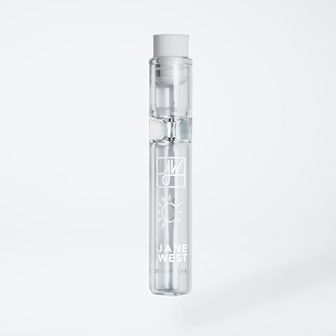 A studio shot of the Day Travel Pipe, a clear glass pipe presented against a plain white background. A studio shot of the Day Travel Pipe, a clear glass pipe presented against a plain white background.