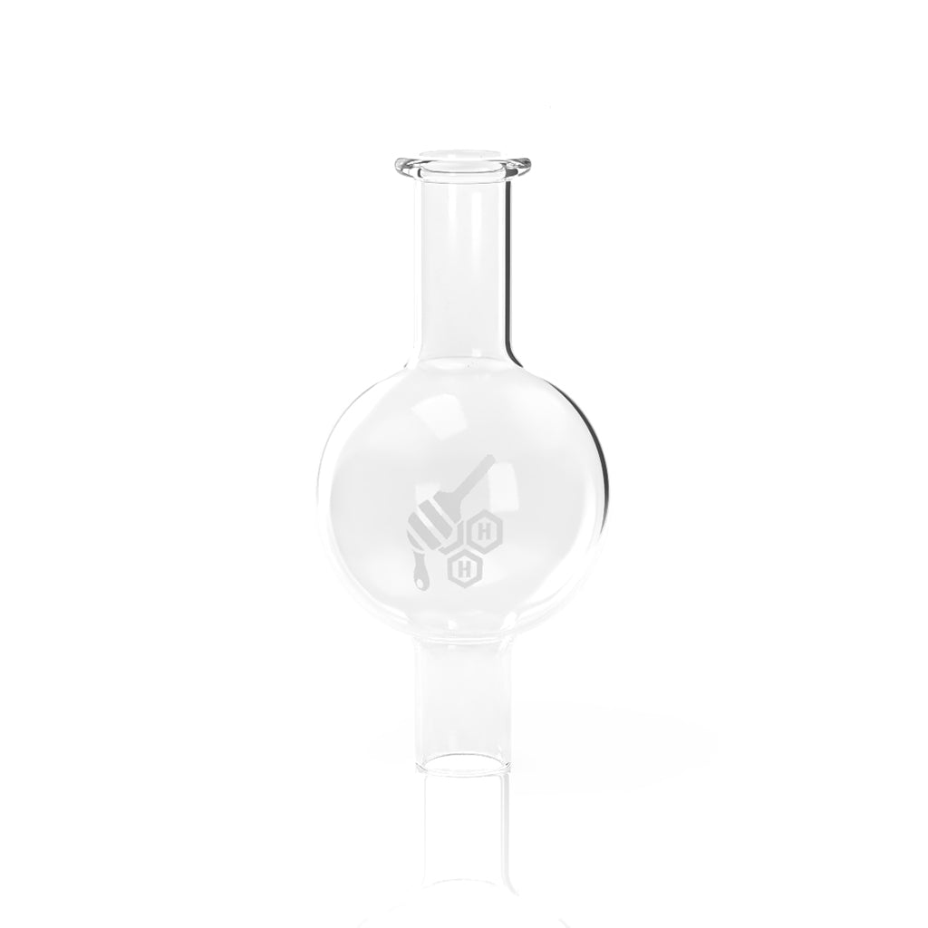 A detailed studio shot of the Quartz Bubble Cap, displaying its clear glass construction and rounded shape. A detailed studio shot of the Quartz Bubble Cap, displaying its clear glass construction and rounded shape.