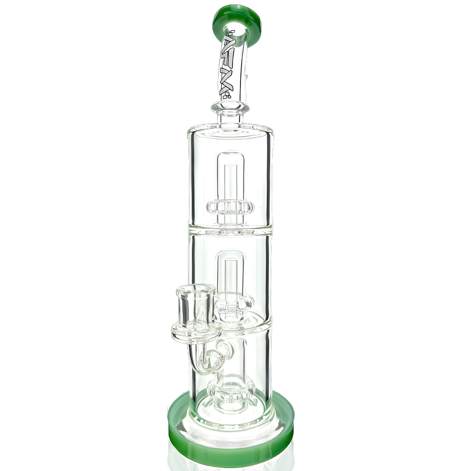 A studio shot of the UFO Triple Stack Rig, displaying a triple-stacked glass rig with a green accent and rounded shape. A studio shot of the UFO Triple Stack Rig, displaying a triple-stacked glass rig with a green accent and rounded shape.