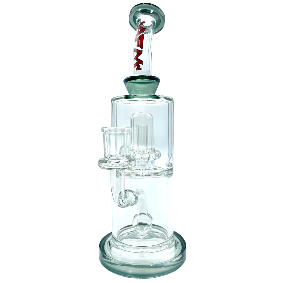 Front view of the Dot Double Perc Glass Rig, showcasing its clear glass construction and multi-chamber percolator design. Front view of the Dot Double Perc Glass Rig, showcasing its clear glass construction and multi-chamber percolator design.