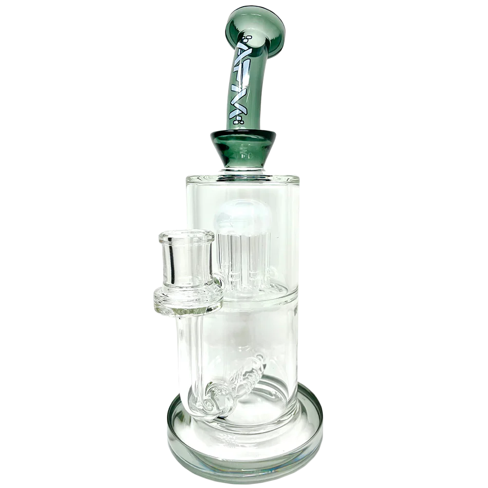 A studio shot of the Inline To Arm Rig, showcasing its clear glass construction and angled arm for accessory attachment. A studio shot of the Inline To Arm Rig, showcasing its clear glass construction and angled arm for accessory attachment.