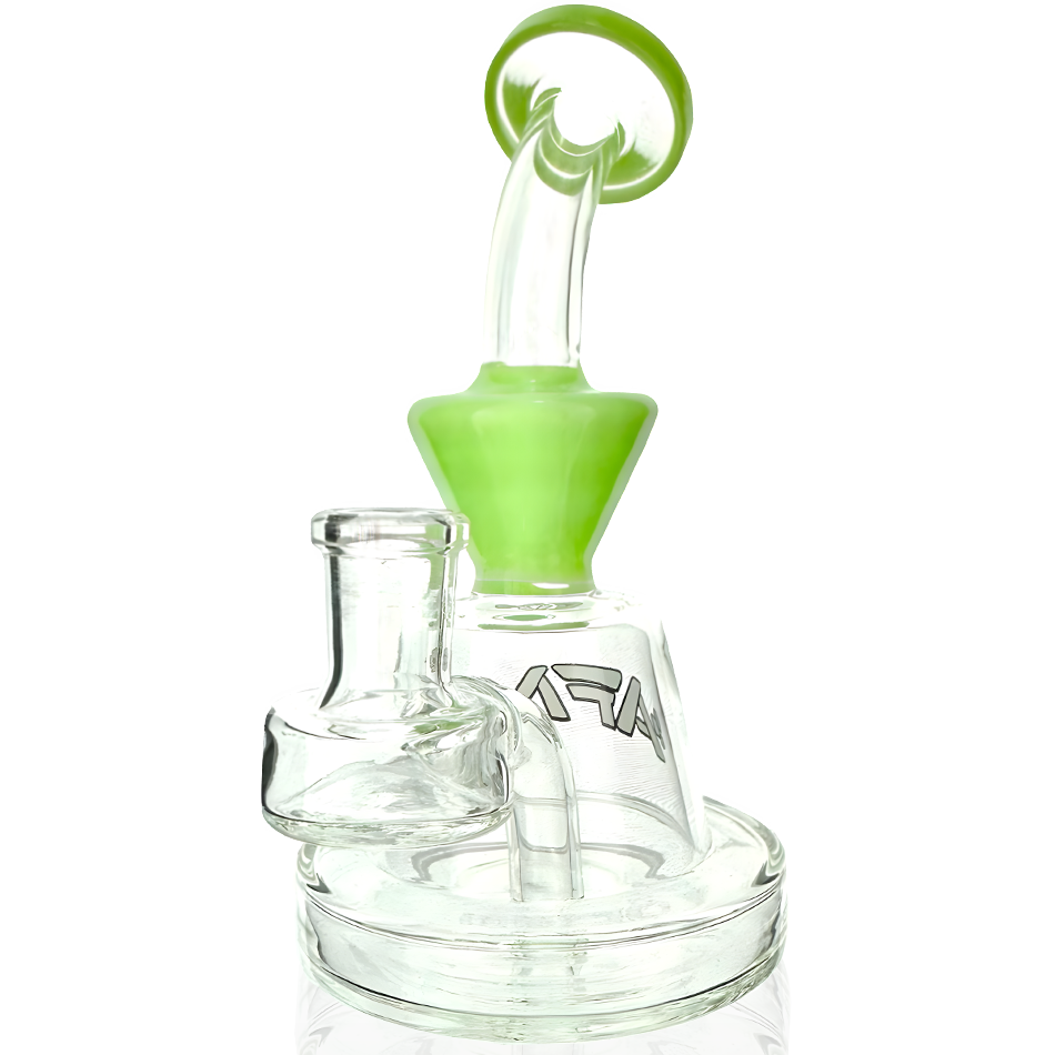 Front view of the Little Killer Clear Glass Mini Rig, showing a small, clear glass rig with a green accent piece. Front view of the Little Killer Clear Glass Mini Rig, showing a small, clear glass rig with a green accent piece.