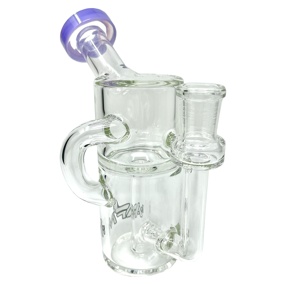 A close-up, angled view of the Power Can Clear Glass Recycler Mini Dab Rig, showcasing its clear glass construction and compact size. A close-up, angled view of the Power Can Clear Glass Recycler Mini Dab Rig, showcasing its clear glass construction and compact size.