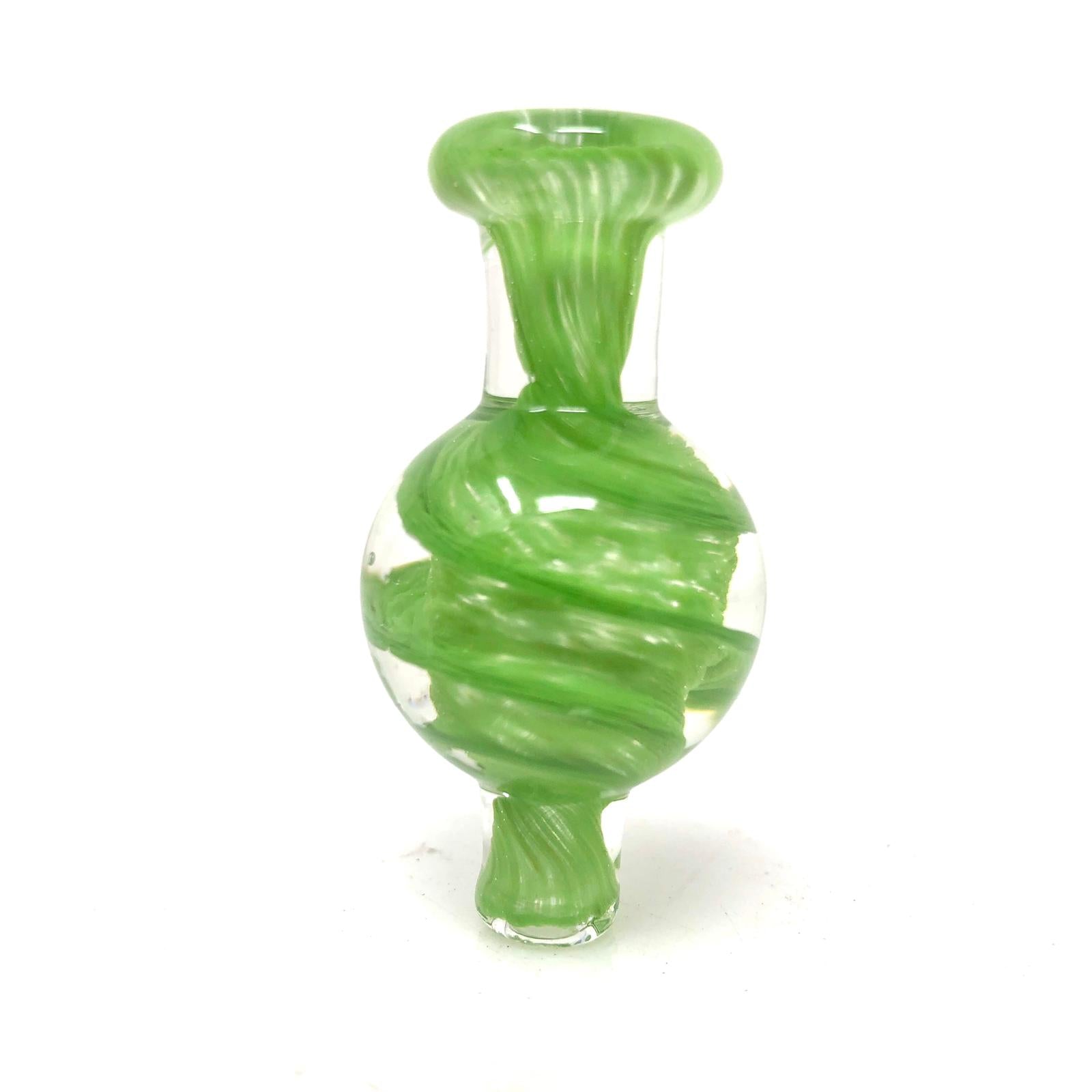 Front view of the Spiral Airflow Carb Cap, a translucent green glass piece with a swirling, conical shape against a plain white background. Front view of the Spiral Airflow Carb Cap, a translucent green glass piece with a swirling, conical shape against a plain white background.
