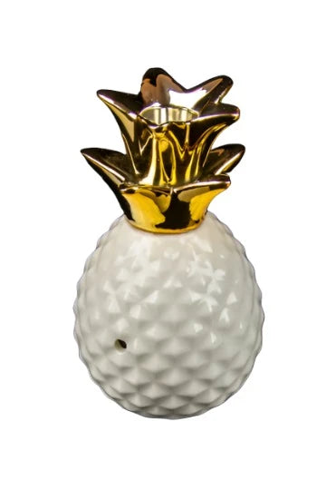 Front view of the Pineapple Pipe, a white, sculpted piece resembling a tropical fruit. Front view of the Pineapple Pipe, a white, sculpted piece resembling a tropical fruit.