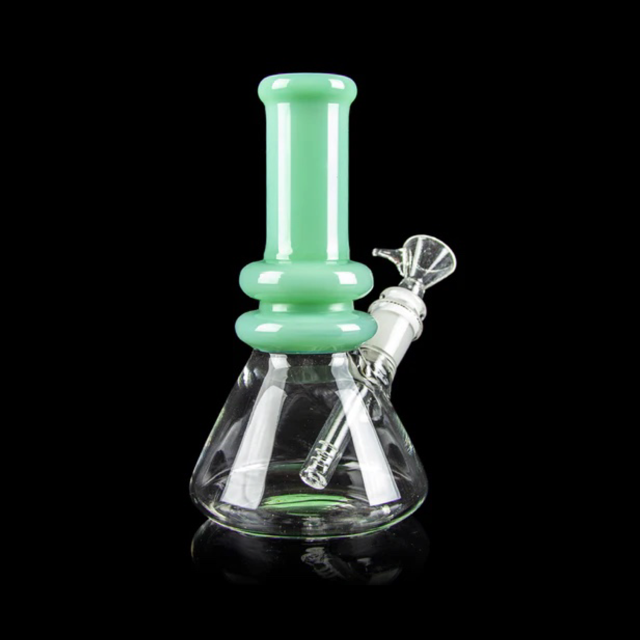 Front view of the Minty Bong, a mint-green glass bong reflecting on a dark surface. Front view of the Minty Bong, a mint-green glass bong reflecting on a dark surface.
