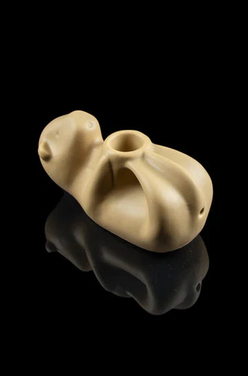 The Otter Pipe is shown in a close-up studio shot with a reflective surface, highlighting its smooth, sculpted form. The Otter Pipe is shown in a close-up studio shot with a reflective surface, highlighting its smooth, sculpted form.