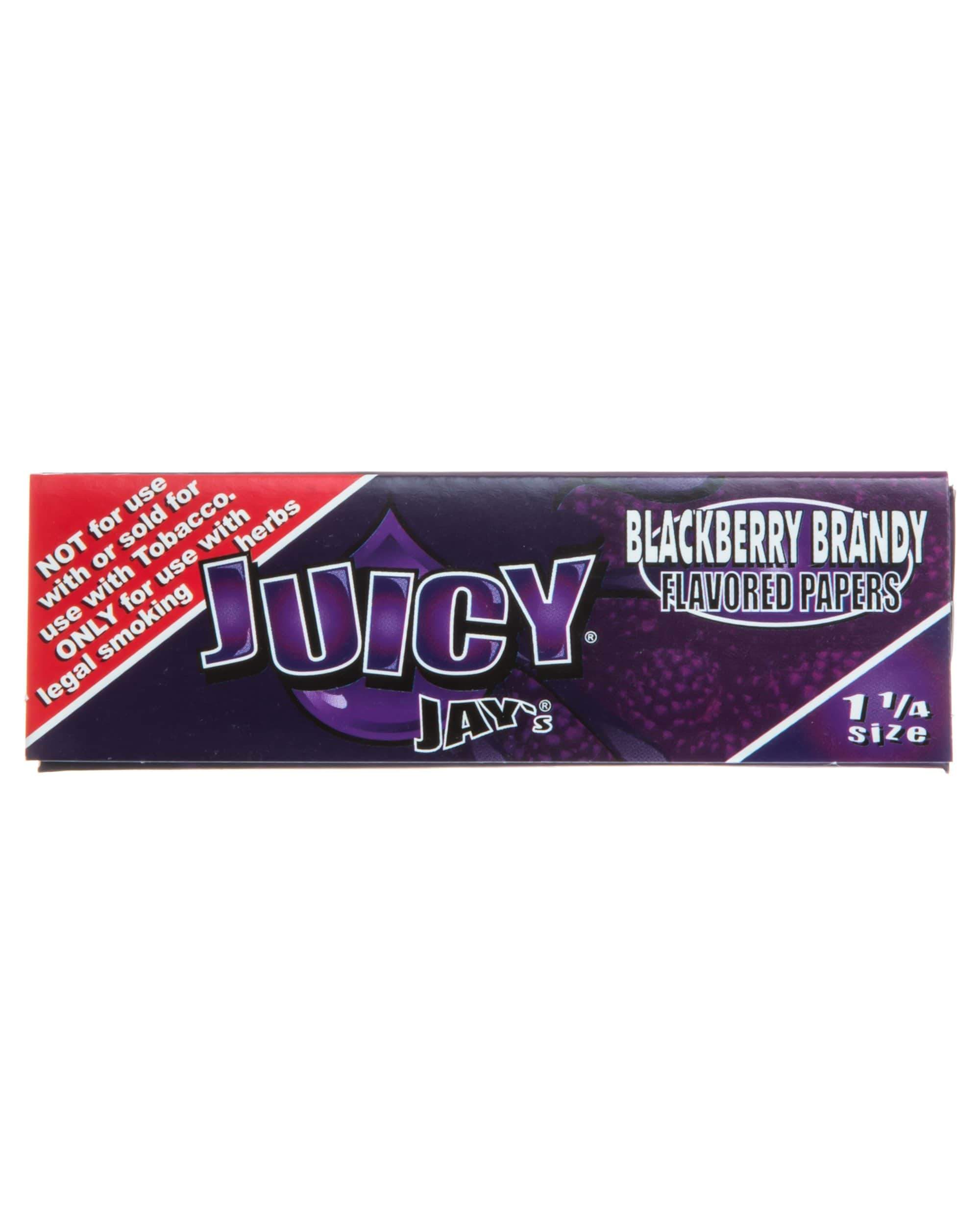 Close-up of Blackberry Brandy 1-1/4 rolling papers with bold text and a colorful design against a dark background. Close-up of Blackberry Brandy 1-1/4 rolling papers with bold text and a colorful design against a dark background.