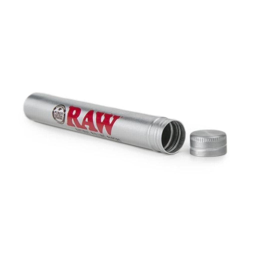 Close-up of the RAW Aluminum Storage Tube, open to reveal its hollow interior and metallic silver finish. Close-up of the RAW Aluminum Storage Tube, open to reveal its hollow interior and metallic silver finish.