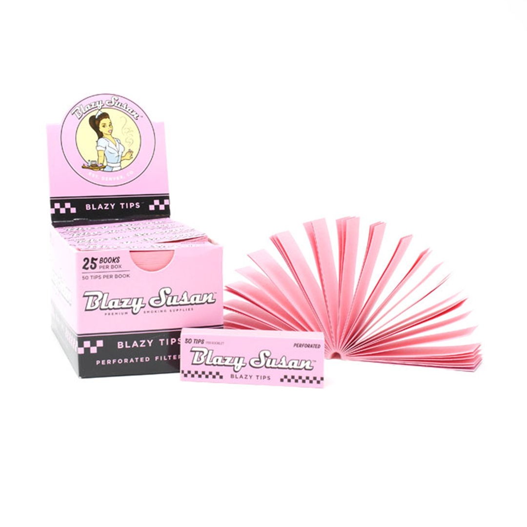 Filter Tips by Suzy's, a stack of paper tips shown from a slight angle with branding on a pink box. Filter Tips by Suzy's, a stack of paper tips shown from a slight angle with branding on a pink box.