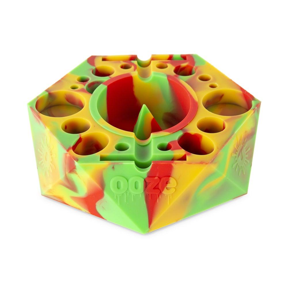 Top-down view of the Bangarang Silicone Ashtray, featuring a colorful, patterned design and multiple bowl-shaped indentations. Top-down view of the Bangarang Silicone Ashtray, featuring a colorful, patterned design and multiple bowl-shaped indentations.