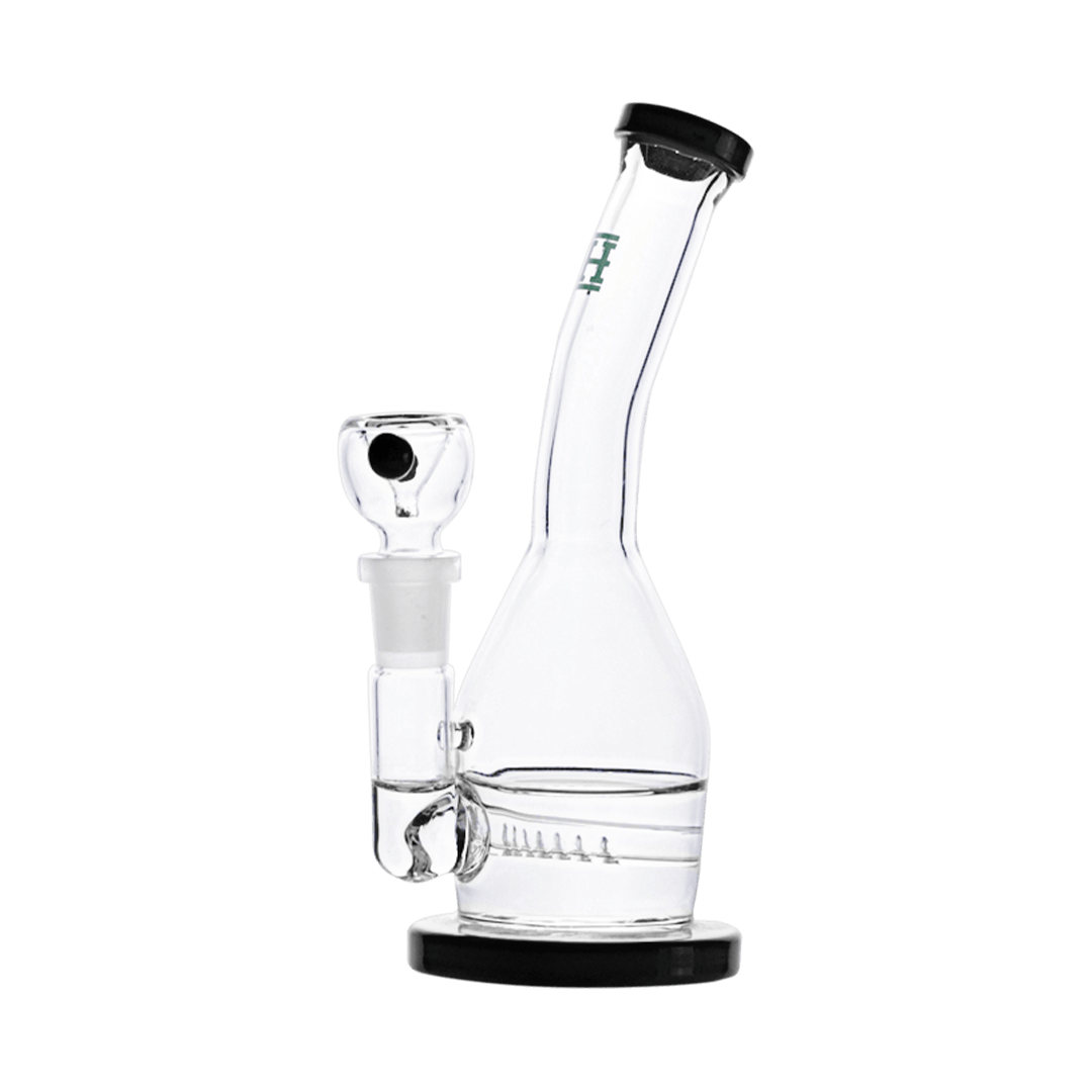 Front view of the Whistler Rig, a clear glass water pipe resting on a black surface. Front view of the Whistler Rig, a clear glass water pipe resting on a black surface.