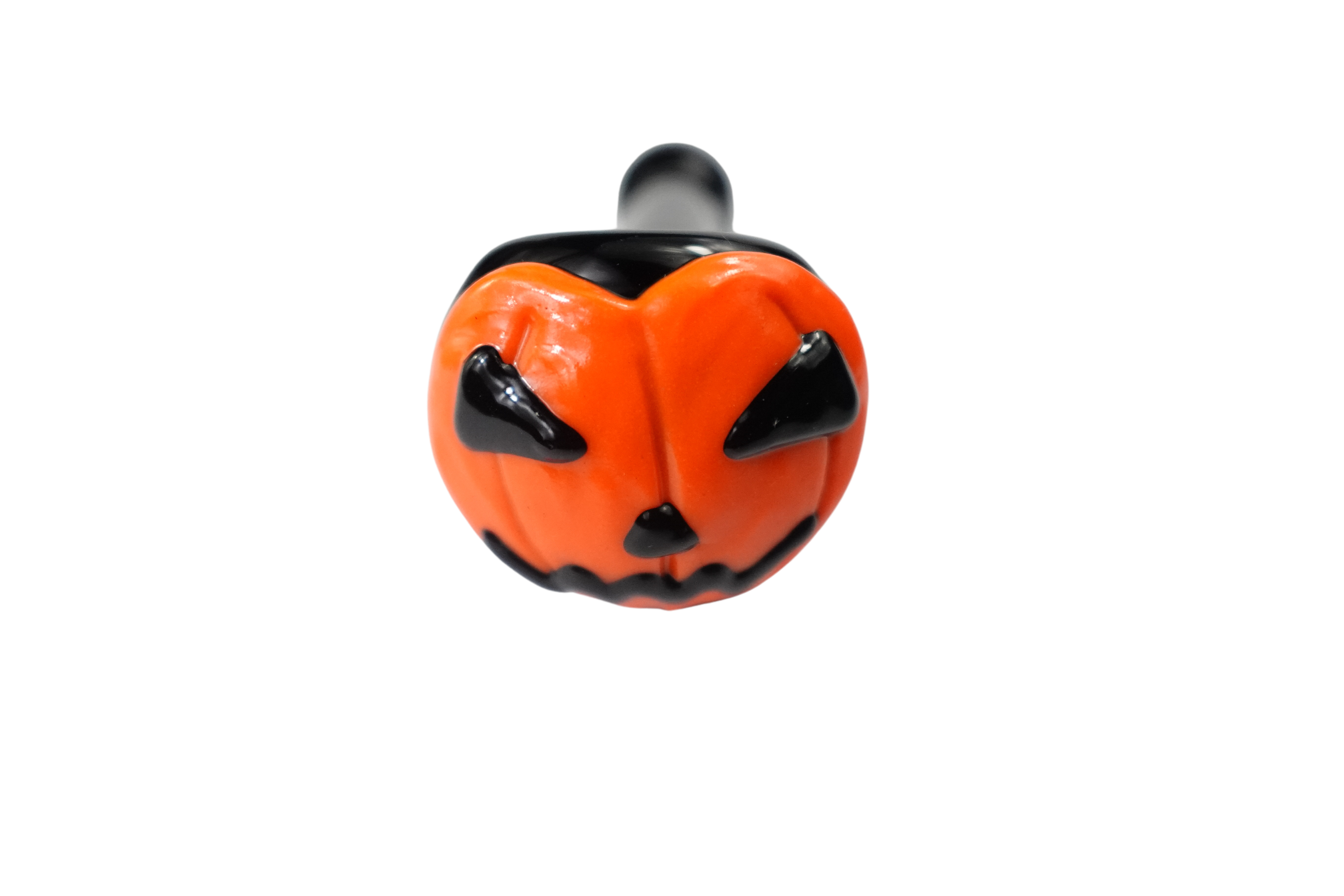 Close-up of the Pumpkin Face Spoon Pipe, showing its orange bowl and unique facial features in a side view. Close-up of the Pumpkin Face Spoon Pipe, showing its orange bowl and unique facial features in a side view.