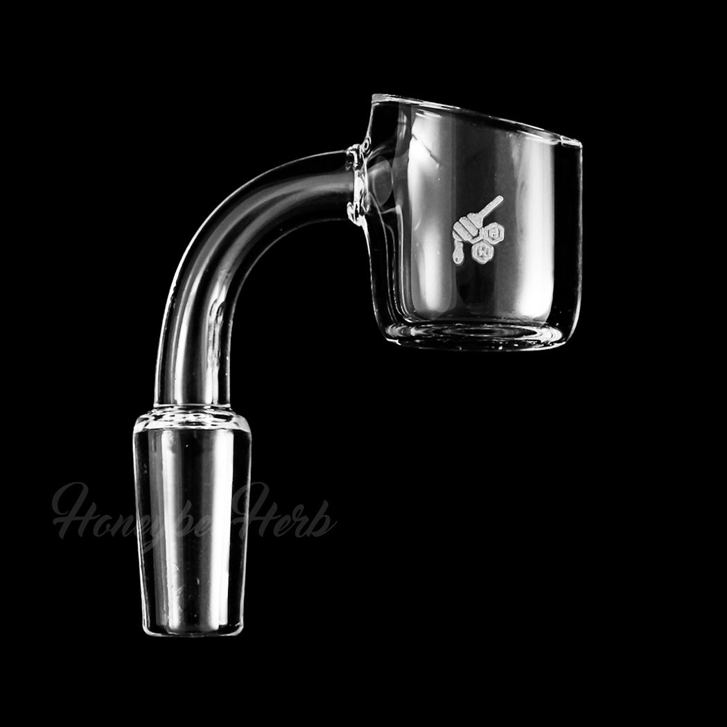 A close-up, angled view of the Original Quartz Banger 90° Yellow Line, showcasing its clear quartz construction and angled joint. A close-up, angled view of the Original Quartz Banger 90° Yellow Line, showcasing its clear quartz construction and angled joint.