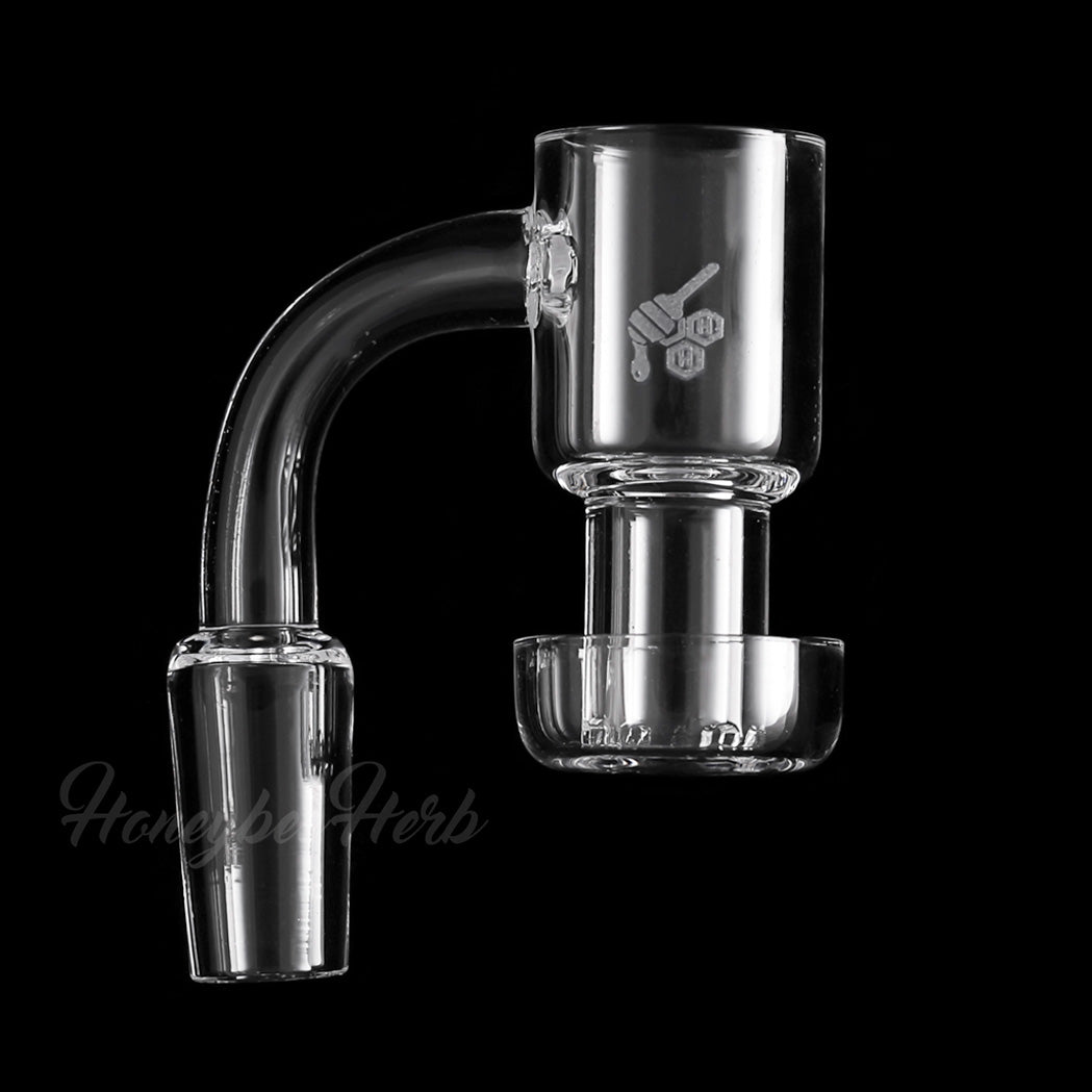 A studio shot of the Honeysuckle Quartz Banger 90° with a yellow line detail, presented at an angle against a dark backdrop. A studio shot of the Honeysuckle Quartz Banger 90° with a yellow line detail, presented at an angle against a dark backdrop.