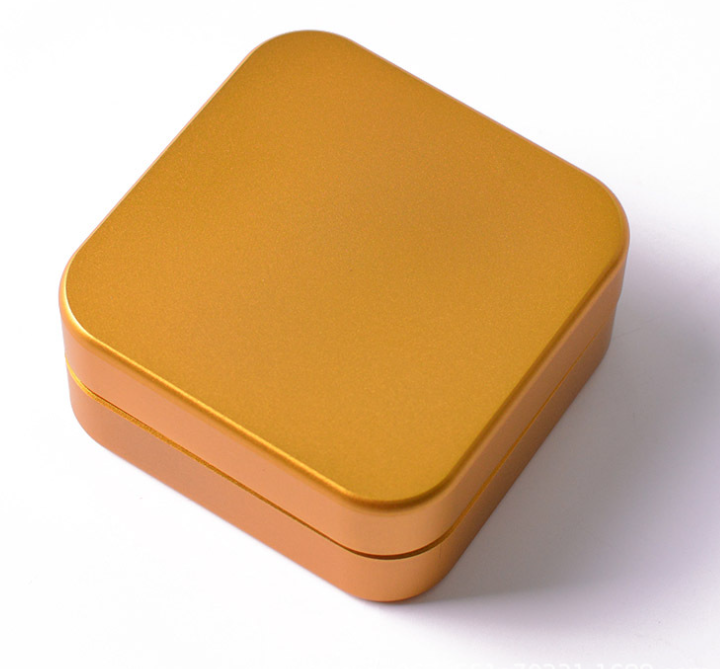 A top-down view of the 2-Piece Aluminum Square Grinder, showcasing its sleek, square design and metallic finish. A top-down view of the 2-Piece Aluminum Square Grinder, showcasing its sleek, square design and metallic finish.