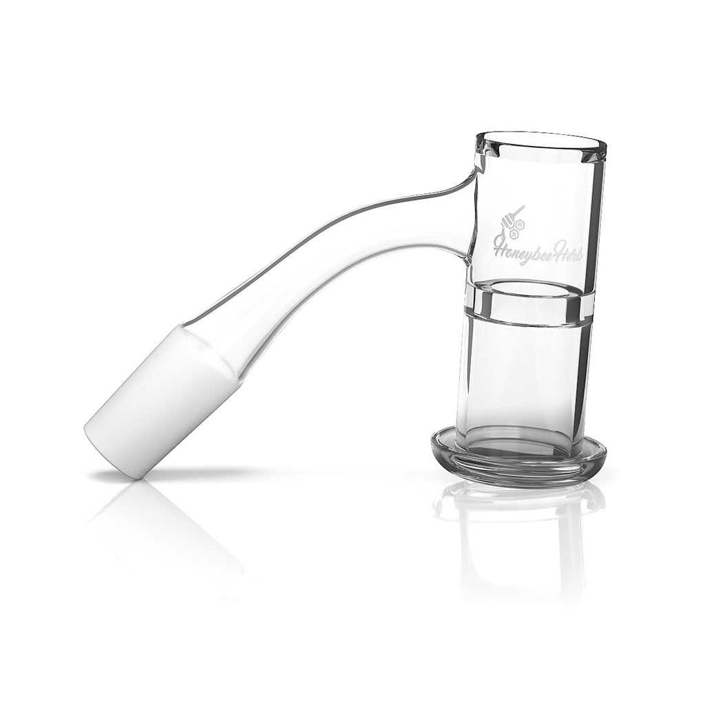 A close-up, angled view of the Honeysuckle XL Quartz Banger with a black line, resting on a clear acrylic base. A close-up, angled view of the Honeysuckle XL Quartz Banger with a black line, resting on a clear acrylic base.