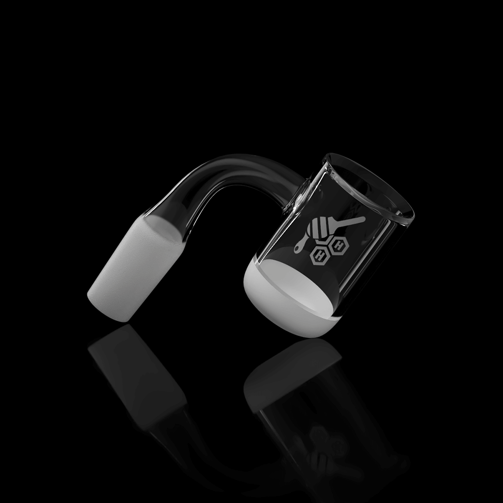 A slightly angled studio shot of the Honey & Milk Bevel Bowl Quartz Banger, featuring a yellow line accent and reflective surface. A slightly angled studio shot of the Honey & Milk Bevel Bowl Quartz Banger, featuring a yellow line accent and reflective surface.