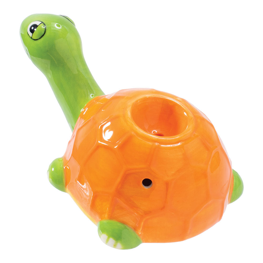 Front view of the Sea Turtle Ceramic Pipe, showing a green-glazed head and textured, orange body in a playful design. Front view of the Sea Turtle Ceramic Pipe, showing a green-glazed head and textured, orange body in a playful design.