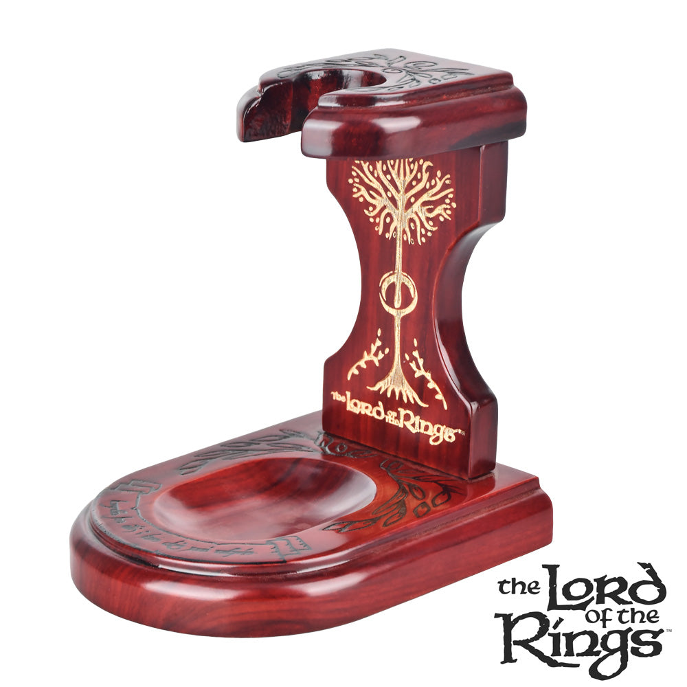 Front view of the Middle Earth Shire Pipe Stand, a dark wood display piece with carved details. Front view of the Middle Earth Shire Pipe Stand, a dark wood display piece with carved details.