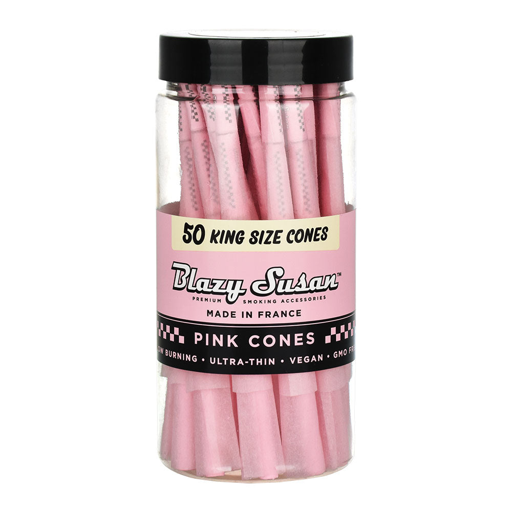 A close-up, angled view of a jar filled with Pink Pre-Rolled Cones, showcasing their stacked arrangement inside the transparent container. A close-up, angled view of a jar filled with Pink Pre-Rolled Cones, showcasing their stacked arrangement inside the transparent container.